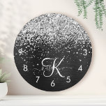 Custom Silver Glitter Black Sparkle Monogram Round Clock<br><div class="desc">Easily personalize this trendy elegant round clock design featuring pretty silver sparkling glitter on a black brushed metallic background.</div>