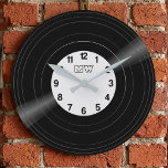 Custom Vinyl Record Vintage Monogram Clock<br><div class="desc">Bring the golden era of music into your home with this sleek, customizable vinyl record wall clock. Designed with a high-fidelity aesthetic, this clock features a realistic record groove image and a personalized center label. It is customizable: Change the background color of the record label and the clock numbers to...</div>