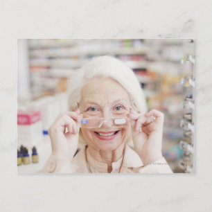 Customer trying in prescription eyeglasses in postcard