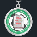 Customisable photo soccer ball silver plated necklace<br><div class="desc">Black and white soccer ball football on a marked soccer pitch customised with your favourite photograph of your own soccer star. Great personalised gift or award for any soccer player,  soccer girl,  or soccer mum</div>