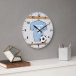 Customisable Soccer Shirt  Sky Blue and White Large Clock<br><div class="desc">Sky blue and white soccer jersey with soccer ball hanging in a changing room. This design is fully customisable with your own name and number. Great gift for any soccer player, soccer girl, soccer mum or soccer fan. We can make this product in any jersey colour combination just contact us...</div>