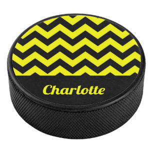 Customisable yellow and black chevron pattern hockey puck