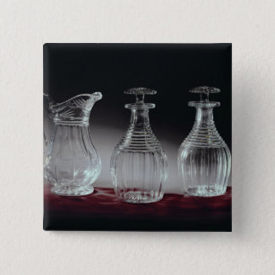 Cut glass decanters and jug, c.1840 15 cm square badge