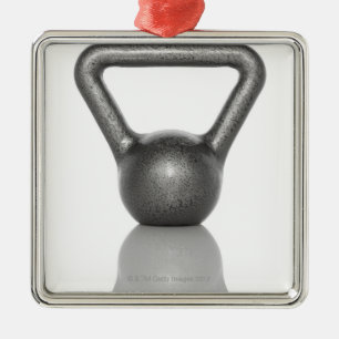 Cut out of a kettle bell on white background metal ornament