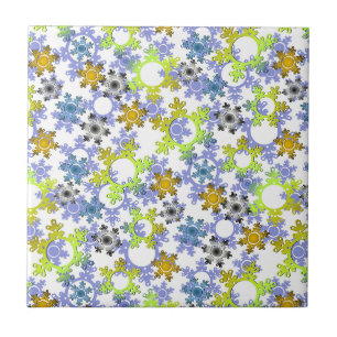 Cut paper snowflakes multicolored on white ceramic tile