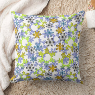 Cut paper snowflakes multicolored on white cushion