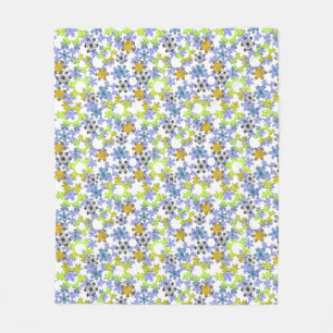 Cut paper snowflakes multicolored on white fleece blanket