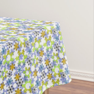 Cut paper snowflakes multicolored on white tablecloth