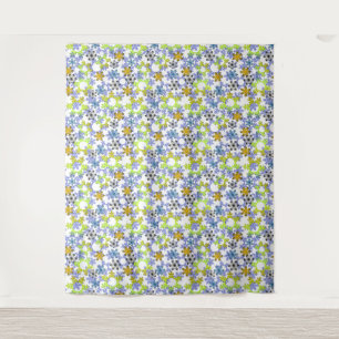 Cut paper snowflakes multicolored on white tapestry