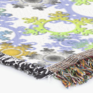 Cut paper snowflakes multicolored on white throw blanket
