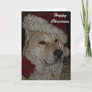 Cute akita in red santa hat portrait christmas holiday card