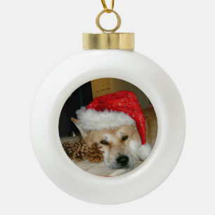 Cute akita in red santa hat with christmas cones ceramic ball christmas ornament