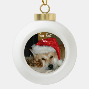 Cute akita in red santa hat with christmas cones ceramic ball christmas ornament