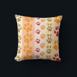 Cute Animal Paw Prints Pattern in Natural Colours Cushion<br><div class="desc">A cute design with several rows of animal paw prints in natural colours like brown,  yellow,  red and orange on a striped pattern. Some paws have claws and others do not.</div>