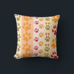 Cute Animal Paw Prints Pattern in Natural Colours Cushion<br><div class="desc">A cute design with several rows of animal paw prints in natural colours like brown,  yellow,  red and orange on a striped pattern. Some paws have claws and others do not.</div>
