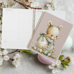 Cute baby bunny in pajamas with an Easter egg Planner