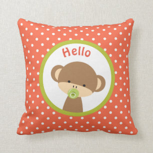 Cute Baby Monkey with a Pacifier on Polka Dots Cushion