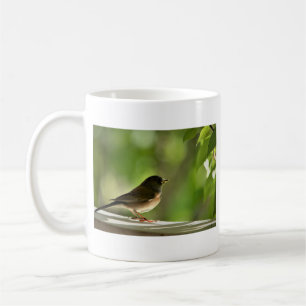 Cute bird in green leaves photography coffee mug