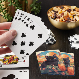 Cute black cat playing cards