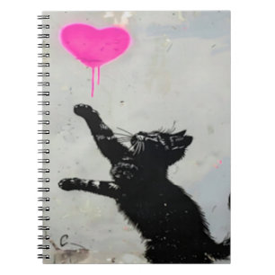 Cute Black Cat Playing with A Pink Heart Notebook