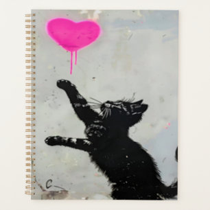 Cute Black Cat Playing with A Pink Heart Planner