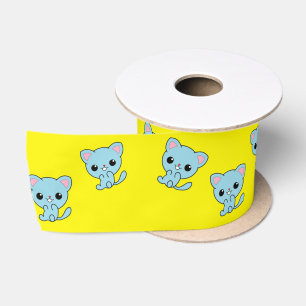 Cute bouncy blue kitten on yellow satin ribbon