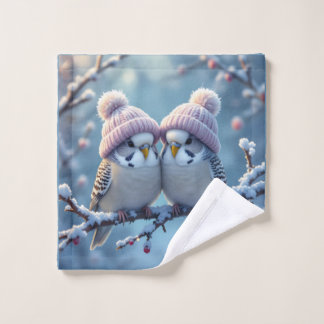 Cute budgies with bobble hats on a branch wash cloth