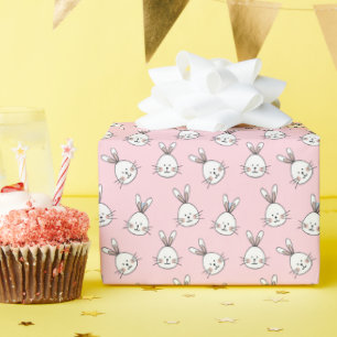 Cute bunny face pattern on light pink wrapping paper