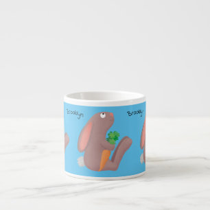Cute bunny rabbit sitting with carrot cartoon espresso cup
