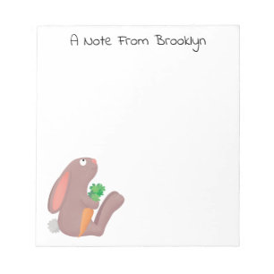 Cute bunny rabbit sitting with carrot cartoon notepad