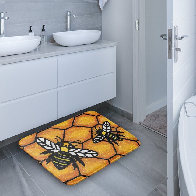 Cute Buzzing Yellow Jacket Bee Honeycomb Bath Mat (Two yellow and black bumble bees on golden yellow honeycomb bath mat.)