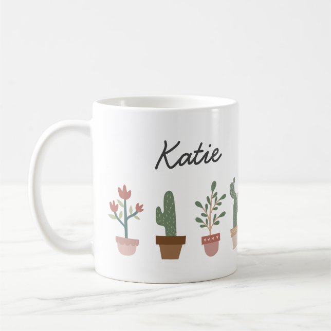 Cute cactus and flowers in a pot coffee mug (Left)
