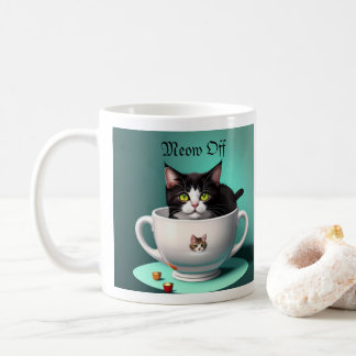 cute cat in a cute mug not being cute