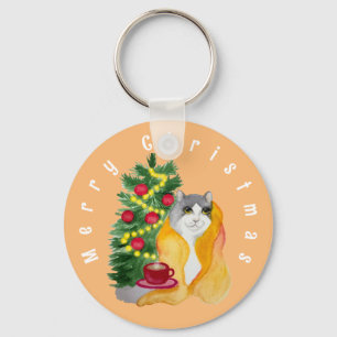 Cute cat under a cosy blanket with a cup of tea key ring