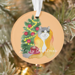 Cute cat under a cosy blanket with a cup of tea ornament