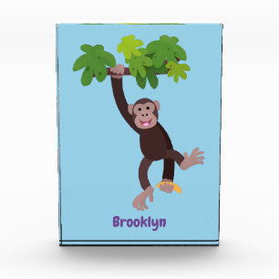 Cute chimpanzee in jungle hanging cartoon photo block