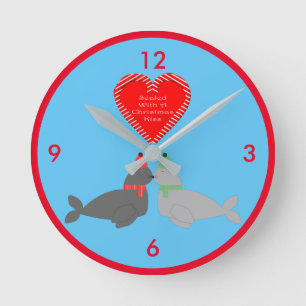 Cute Christmas Kissing Seals Round Clock
