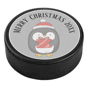 Cute Christmas Penquin with Hat and Package Hockey Puck