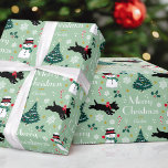 Cute Christmas Scottie Dog Snowman Green Editable Wrapping Paper<br><div class="desc">Add a little whimsical charm to the holiday season with this cute Christmas gift wrap! An editable template, personalised with your family or the recipient's name. This seamless pattern features original artwork of a Scottie dog wearing a red bow, as he dashes along in the snow! There's a happy snowman...</div>