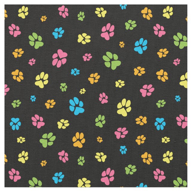 Cute colourful dog paw prints pattern on black fabric (Close Up)