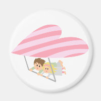 Cute couple flying on a heart-shaped hang-glider
