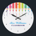 Cute Custom Teacher Rainbow Artistic Classroom Large Clock<br><div class="desc">Beautiful line of coloured pencils leaving a pretty colourful squiggle streaked across the page in cute rainbow colours to decorate the top of this personalised wall clock. Customise with classroom decor with your name or other text in blue.</div>