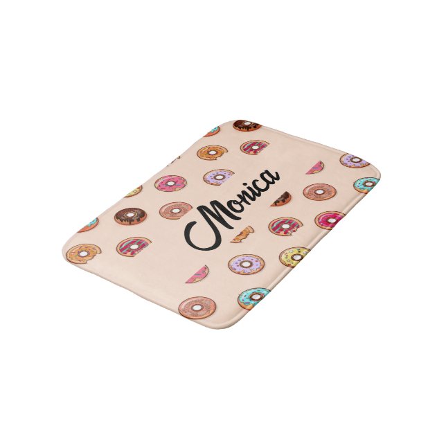 Cute decorative doughnuts on pink bath mat (Angled)