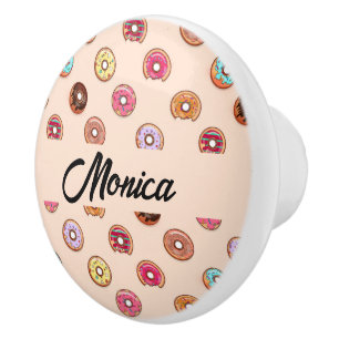 Cute decorative doughnuts on pink ceramic knob