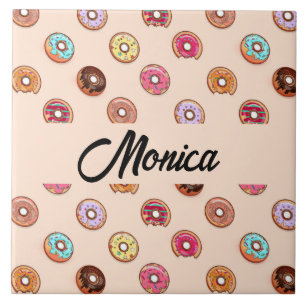 Cute decorative doughnuts on pink ceramic tile