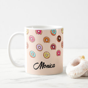 Cute decorative doughnuts on pink coffee mug