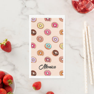 Cute decorative doughnuts on pink napkin