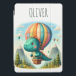 Cute Dinosaur Flying in a Hot Air Balloon iPad Pro Cover<br><div class="desc">Let your little explorer soar above the clouds with this personalised iPad cover featuring a charming dinosaur on a magical mountain adventure! Picture a vibrant hot air balloon drifting over majestic peaks, creating a whimsical scene. It's also uniquely personalised with your child's name, making it a cherished keepsake for years...</div>