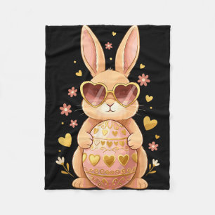 Cute easter bunny with heart sunglasses holding fleece blanket