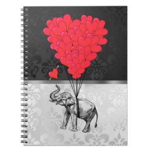 Cute elephant and love heart on grey notebook
